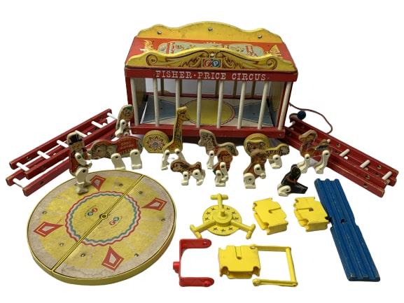 1962 FISHER PRICE CIRCUS SET #900: This is a 1962 Fisher Price Circus Set. The cage works as storage and as a string for a pull toy. Comes with a Circus ring, 4 ladders, animals, a clown and the ringmaster.It is in "used" condition. (S