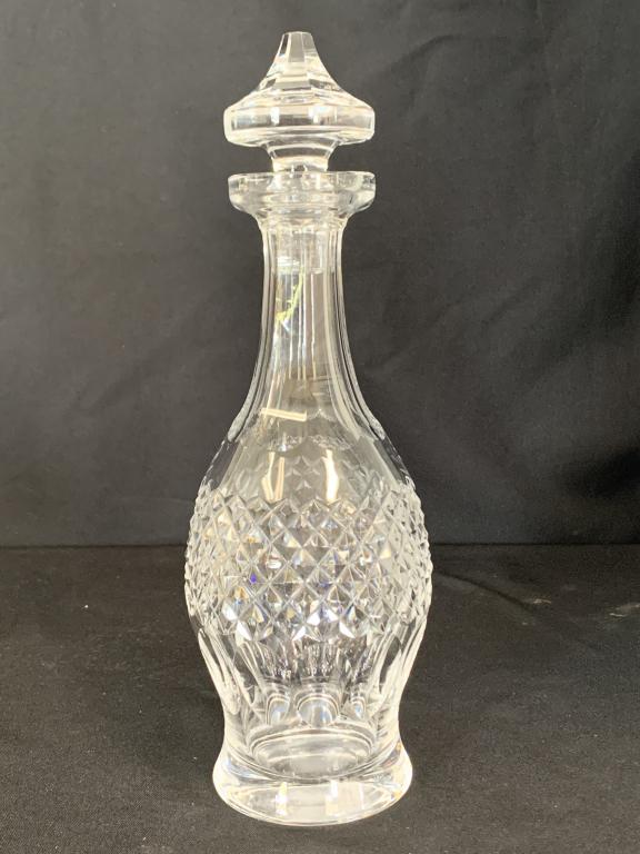 WATERFORD "COLLEEN" WINE DECANTER W/ STOPPER: This hand blown WATERFORD CRYSTAL Wine Decanter with it's Stopper was carfted in Ireland and bears the "Colleen" pattern, and it has a cut base. Measures: 13 3/4" high x 5" wide