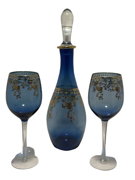 BLUE CRYSTAL WITH 22K GOLD SWAG DECANTER SET: BLUE CRYSTAL WITH 22K GOLD SWAG DECANTER SET INCLUDES: Decanter with stopper 2 wine glasses Decanter 15" Wine glasses 9"
