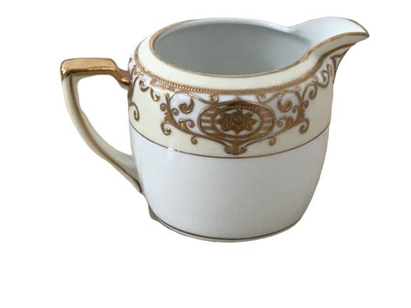 NORITAKE CHINA CREAMER PITCHER PAINTED GOLD TRIM: NORITAKE CHINA CREAMER PITCHER PAINTED GOLD TRIM - 3" tall x 3.75" wide -Handpainted -Made in Japan -Good Condition