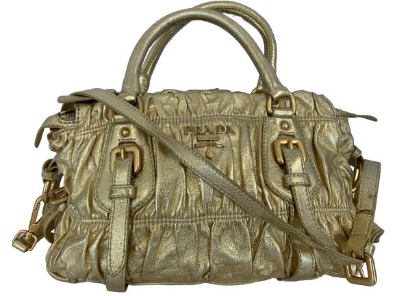 PRADA GOLD HANDBAG WITH BUCKLES: STRIKING PRADA GOLD HANDBAG WITH BUCKLES - 8" h x 12" w - very good condition
