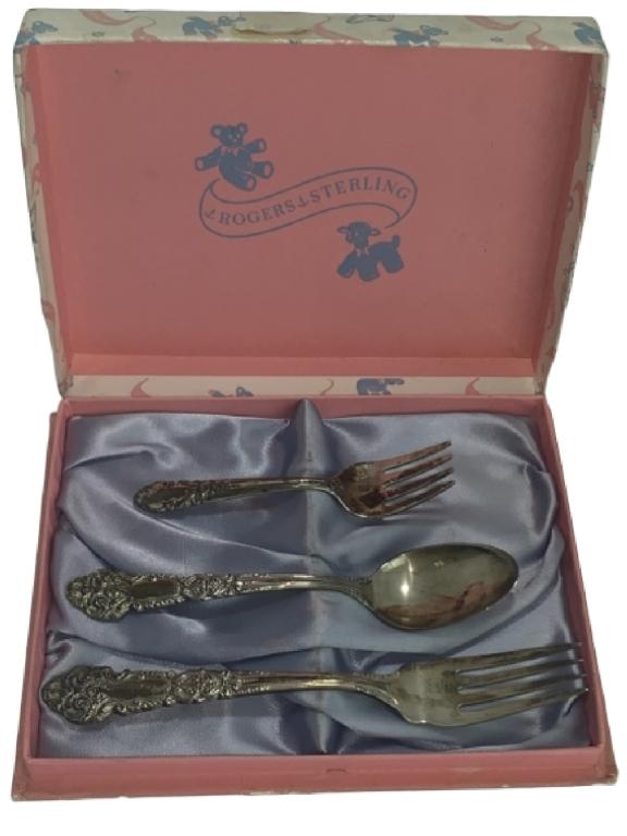VINTAGE ROGERS STERLING SILVER CHILD SILVERWARE: Vintage Rogers Sterling Child's silverware set. Comes with original box. -78 G -Very good condition with tarnishing appropiate for age