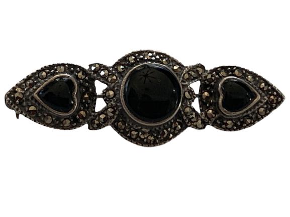 VINTAGE STERLING SILVER AND MARCASITE BROOCH: Vintage sterling silver and marcasite pin. 6.4 grams