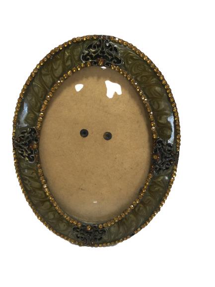 VINTAGE ENAMEL AMBER SWAROVSKI CRYSTAL OVAL FRAME: Gorgeous and inspired by Jay Strongwater. Swirled enamel in olive with amber colored crystals, two stones missing. Overall very good condition. Measures 5" wide by 6" tall. Third party shipping requir