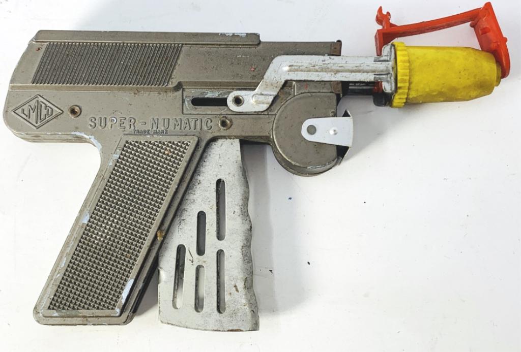 VINTAGE 1950S SUPER NUMATIC TOY CAP POP GUN LMCO: VINTAGE 1950S SUPER NUMATIC TOY CAP POP GUN LMCO vintage lmco super-numatic space age paper cap gun, pretty good overall condition considering age . Third party shipping required