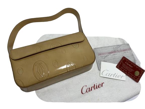 CARTIER PATENT LEATHER BEIGE CC LOGO PURSE BAG: Cartier bag with receipts and COA as shown. Lovely patent leather with CC logo all over. Beautiful and comes with original dust bag.