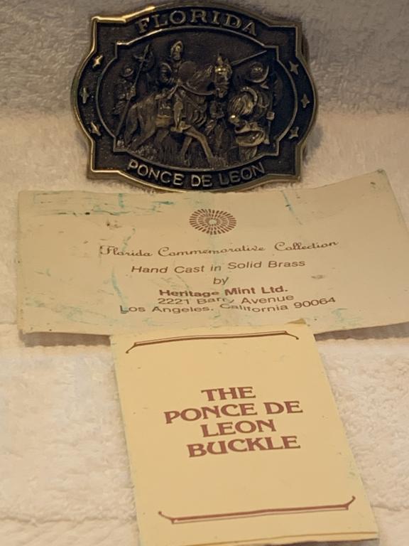 HERITAGE MINT PONCE DE LEON FLORIDA BELT BUCKLE: HERITAGE MINT PONCE DE LEON FLORIDA BELT BUCKLE. Comes in original suede pouch! 3 1/4 X 2 1/4
