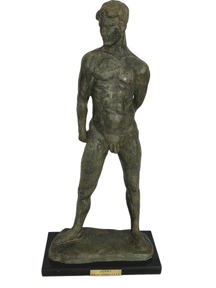 RUTH LEE LEVENTHAL "JERRY" NUDE MALE SCULPTURE: RUTH LEE LEVENTHAL "JERRY" NUDE MALE SCULPTURE - 20" TALL AND 9.5" WIDE - Sculpted in some form of stone composite and glazed to appear bronze - On black base with artists plaque attached - No flaws o