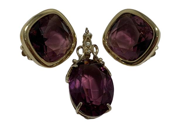 VTG AMETHYST GLASS GOLD PENDANT & CLIP ON EARRINGS: AMETHYST GLASS GOLD PENDANT & CLIP ON EARRINGS WOW- Amethyst colored glass pendant with matching earrings- Pendant has latch in place- Clip on earrings- Earrings are 1" in size- Pendant is 1.5" in len