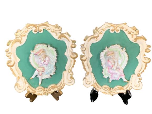 PAIR OF ANTIQUE PORCELAIN FRAMES: Depicts young boy playing the piccolo, as well as a young woman posing. 12"H x 11"W.