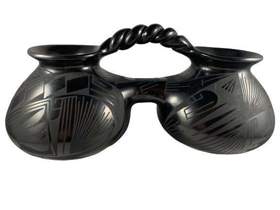 OSCAR DE QUIZADO SAN ILDEFONSO POTTERY DUO VESSEL: Black pottery vessel with two sides by Oscar de Quizado San Ildefonso pottery. Great condition. 8" in width.
