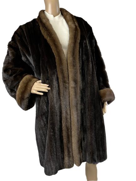 KARABELAS GUY LAROCHE MID LENGTH MINK COAT: KARABELAS GUY LAROCHE MID LENGTH MINK COAT -GORGEOUS MINK COAT IN CONTRASTING FURS. DESIGNED TO BE HUNG OPEN AND SHOWCASE YOUR STUNNING OUTFIT UNDERNEATH. PADDED DROPPED SHOULDERS.-FLAT LAY MEASUREMEN