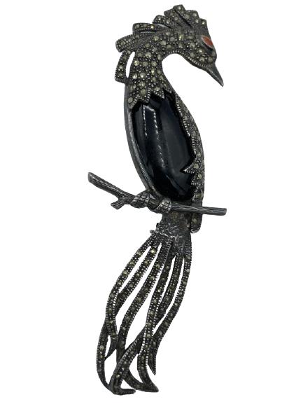 STERLING SILVER MARCASITE BIRD BROOCH 4.25": STERLING SILVER MARCASITE BIRD BROOCH 4.25" - STERLING SILVER BIRD ACCENTED IN BLACK WITH ENAMEL EYES AND MARCASITE PLUMMAGE.-4.25" X 1.5"-WEIGHT 23.9G-VERY GOOD CONDITION