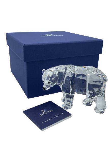 SWAROVSKI CRYSTAL POLAR BEAR 2.5": SWAROVSKI CRYSTAL POLAR BEAR 2.5" -A PLAYFUL POLAR BEAR BY SWAROVSKI MADE IN AISTRIA. -INCLUDES ORIGINAL PACKAGING AND AUTHENTICATION CERTIFICATE. -RETAIL PRICE $185 -HEIGHT 2.5" WIDTH 3.75" -PRISTINE