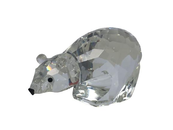 SWAROVSKI CRYSTAL POLAR BEAR RETIRED FIGURINE: SWAROVSKI CRYSTAL POLAR BEAR FIGURINE - HAS BLACK EYES AND NOSE - THIS FIGURINE WAS INTRODUCED IN 1986 AND RETIRED IN 1998 - 2" H X 3-1/2" L X 1-1/2" W - SIGNED WITH SWAROVSKI STAMP - DOES NOT INCLUDE