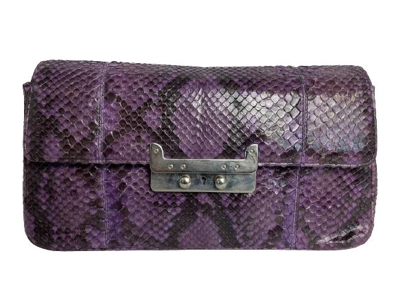 LAI PURPLE PYTHON CLUTCH: LAI PURPLE PYTHON CLUTCH -PURPLE PYTHON CLUTCH WITH METAL LOCK AND KEY CLOSURE. A FUN CLUTCH TO ADD TO YOUR COPLLECTION.-HEIGHT 7" LENGTH 12.5" WIDTH 2.25"-GOOD CONDITTION A FEW SIGNS OF WEAR ON THE B