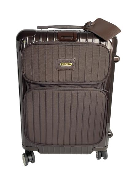 RIMOWA BROWN CARRY ON BAG NEVER BEEN USED: RIMOWA BROWN CARRYON BAG NEVER BEEN USED -LIGHT WEIGHT AND DURABLE SOUGHT AFTER GERMAN DESIGNED AND MADE IN CANADA RIMOWA ROLLING CARRY ON BAG. -NEVER BEEN USED -21" X 15.5" X 9.5"-RETRACTABLE HANDLE 