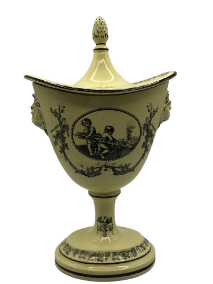 MOTTAHEDEH MID CENTURY YELLOW URN REPRO 11": MOTTAHEDEH MID CENTURY YELLOW URN WITH LION HANDLES AND ARTICHOKE LID MARKED REPRODUCTION ON BOTTOM-11" X 7" X3" APPROX-POSSIBLE REPAIR TO ARTICHIOKE TOP-DP1821