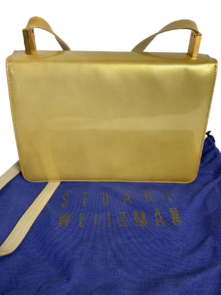 VINTAGE STUART WEITZMAN SPAIN GOLD FLAP HANDBAG: VINTAGE STUART WEITZMAN SPAIN GOLD FLAP HANDBAG - METALLIC GOLD PURSE- SIGNED "STUART WEITZMAN"- MADE IN SPAIN- FLAP CLOSURE- 2 INTERIOR POCKETS, 1 ZIPPERED- COMES WITH ORIGINAL DUST BAG- SOME DISCOLO