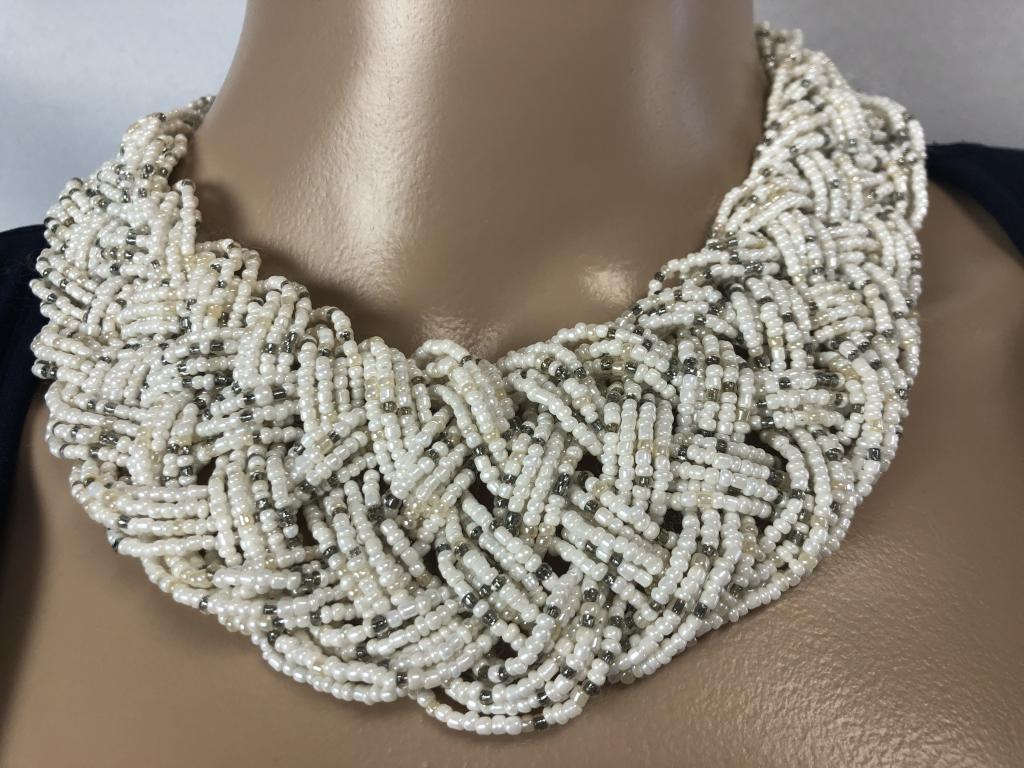 VTG WHITE BRAIDED CHOKER-STYLE NECKLACE: VTG WHITE BRAIDED CHOKER-STYLE NECKLACE - VINTAGE CHOKER STYLE NECKLACE- MANY STRANDS OF SMALL WHITE AND SILVER BEADS- LOBSTER CLASP - VERY GOOD VINTAGE CONDITION- JT012521