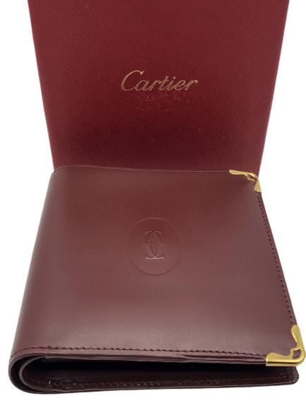 VTG CARTIER RED LEATHER WALLET IN BOX 4": VTG CARTIER RED LEATHER CARDHOLDER WALLET WITH GOLD CORNER ACCENTS IN BOX -4" X 4" APPROX-VERY GOOD CONDITION, NEW IN BOX WITH ORIGINAL PAPERWORK-DP12621