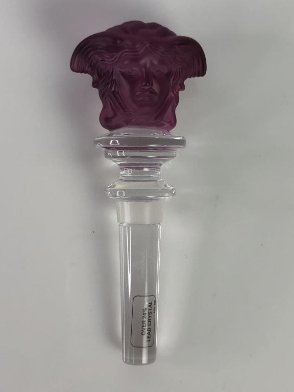 VTG VERSACE MEDUSA PURLE CRYSTAL BOTTLE STOPPER: VTG VERSACE MEDUSA PURLE CRYSTAL BOTTLE STOPPER SIGNED- 5"- PART OF "MEDUSA LUMIERE" COLLECTION- FROSTED MEDUSA HEAD ON BOTH SIDES OF STOPPER- MADE IN AUSTRIA- CHIPPED AT BASE OF STOPPER