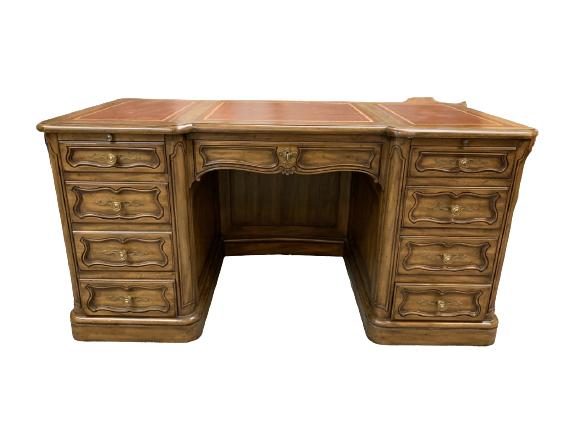 VINTAGE KARGAS LEATHER TOP EXECUTIVE DESK: VINTAGE KARGAS LEATHER TOP EXECUTIVE DESK WITH EIGHT DRAWERS INCLUDING ONE FILE SIZE DRAWER AND ONE LOCKING DRAWER AND BEAUTIFUL GOLD ACCENT LEATHER TOP AND TWO EXTENDABLE WRITING TABLETS, FINISHED FR