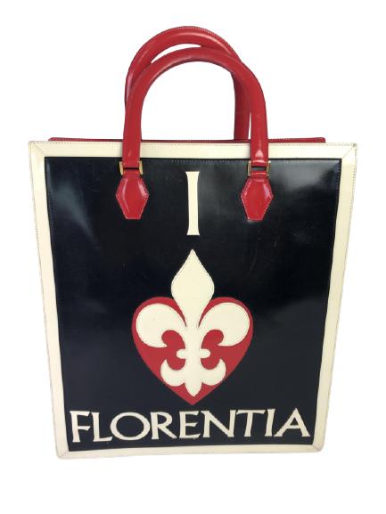 VTG MOSCHINO FLORENTIA LEATHER SHOPPER BAG 12.5": VTG MOSCHINO FLORENTIA LEATHER SHOPPER BAG 12.5" - 12.5" X 5" X 14.5"- BLACK, RED & WHITE LEATHER WITH "I HEART/FLEUR DE LIS" ON FRONT- BLACK & WHITE STRIPED LINING WITH SNAP TAB CLOSURE- ONE INSIDE Z