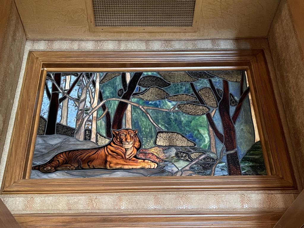 STAINED GLASS LION IN THE JUNGLE: STAINED GLASS LION IN THE JUNGLE-32" x 47" THIS LOT IS LOCATED OFFSITE. PICKUP DAYS FOR THIS LOT WILL BE: THURSDAY, APRIL 15th (12PM-4PM)