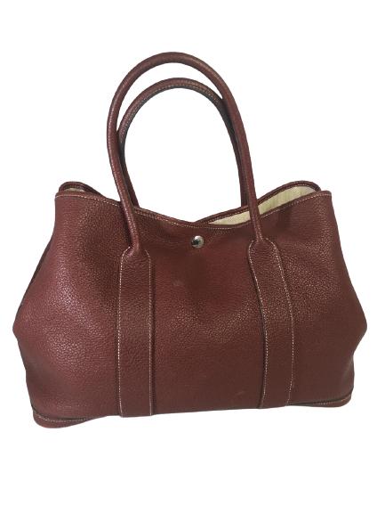 VTG HERMES WINE CALFSKIN GARDEN PARTY TOTE 14.5": VTG HERMES WINE CALFSKIN GARDEN PARTY TOTE 14.5" LUXURY DESIGNER HANDBAG HIGH END LEATHER TOTEBAG14.5" X 7" X 9.5"BURGUNDY CALFSKIN WITH COTTON LININGTWO ROUNDED TOP HANDLES SIDE & FRONT PRESS-STUD FA