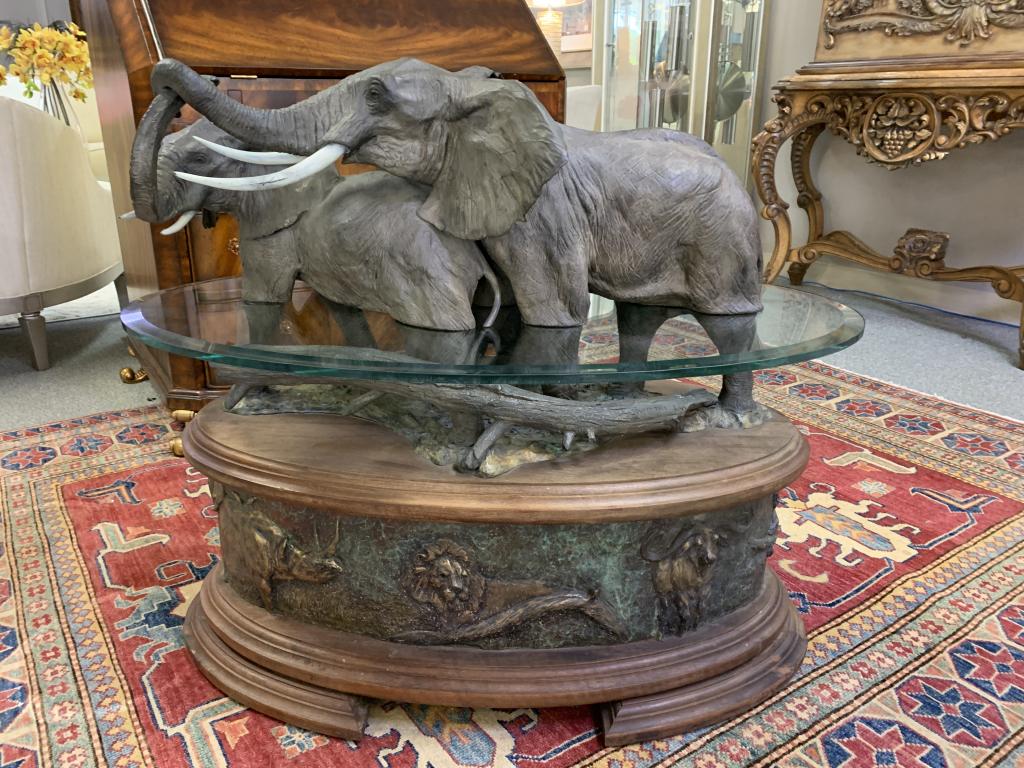 DANIEL RAY PARKER "SWEET TALK" ELEPHANT TABLE 35": VINTAGE DANIEL RAY PARKER "SWEET TALK" BRONZE ELEPHANT WITH MATE AND BABY ELEPHANTS WILDLIFE SAFARI STYLE SCULPTURE TABLE -UNIQUE 2 PIECE GLASS TABLE SEPERATION GIVES THE APPEARANCE OF WATER -30" X 35