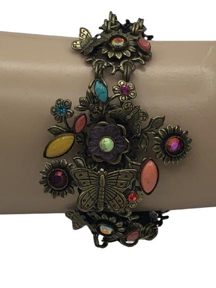 UNIQUE GOLD BRACELET WITH BUTTERFLIES & STONES 7": - GOLD WITH CENTER BUTTERFLY CLUSTER- DOUBLE STRANDS HAVE STONES & FLOWERS- LENGTH IS ADJUSTABLE- GOOD VINTAGE CONDITIONLuxury women's jewelry, ladies accessories , luxe designer, high fashion accesso