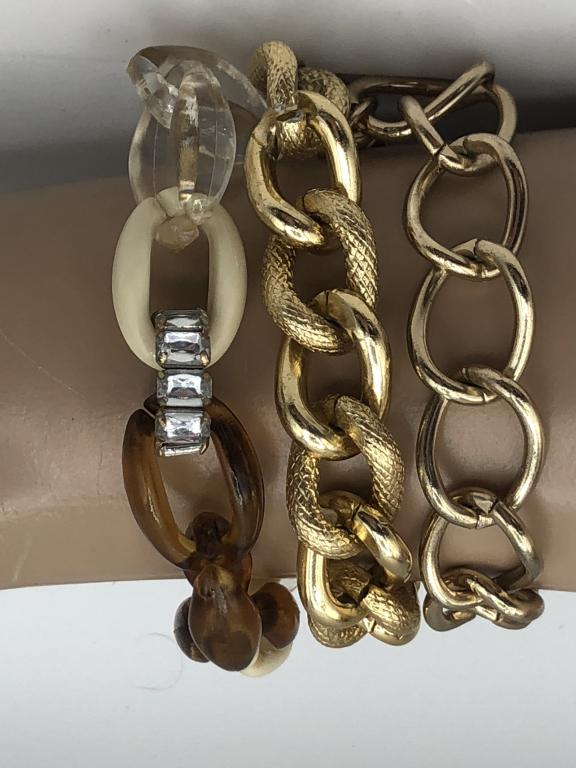 VINTAGE TRIPLE STRAND GOLD CHAIN BRACELET 8": - TWO GOLD CHAIN STRANDS AND ONE STRAND WITH IVORY, TORTOISE & CLEAR OVALS- ONE CLEAR STONE ACCENT- EASY TO MANEUVER CLOSURE- VERY GOOD VINTAGE CONDITIONLuxury women's jewelry, ladies accessories , lu