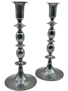 Baldwin & Miller Weighted Sterling Silver Candless: Baldwin & Miller Weighted Sterling Silver Candlesticks -A pair of weighted sterling silver candlesticks from Baldwin & Miller. The candlesticks have turned shafts terminating in round weighted bases.