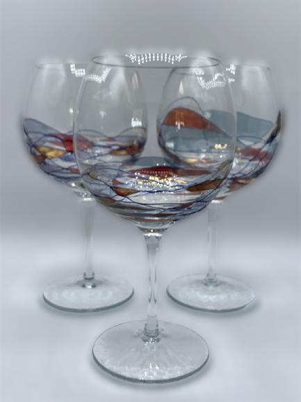 UNIQUE BALLOON WINE GLASSES W/SWIRL DESIGN SET/3: UNIQUE BALLOON WINE GLASSES W/SWIRL DESIGN SET/3 - 8.5" HIGH X 3.25" DIAMETER- BLUE & AMBER COLORED SWIRLS DECOR- VERY GOOD CONDITION - NO CHIPS OR CRACKSCOLLECTIBLE HOME DECOR; LUXURY SERVEWARE; ENTE