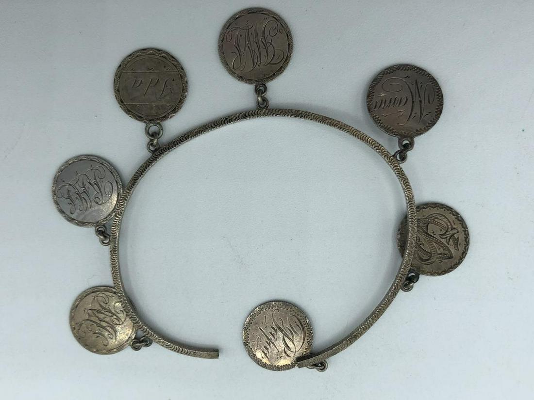 VTG SILVER OPEN BANGLE WITH MONOGRAM CHARMS 3": "VTG SILVER OPEN BANGLE WITH MONOGRAM CHARMS 3"" - EACH CHARM HAS A DIFFERENT NAME, DATE AND/OR MONOGRAM- VINTAGE CONDITION CONSISTENT WITH AGE - SOME TARNISHING (SEE PHOTO)WOMEN'S FINE JEWELRY; HIGH 