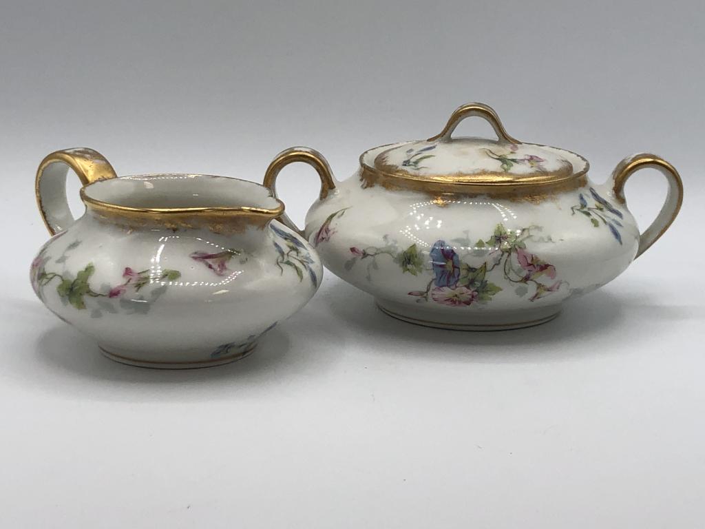 VINTAGE THEODORE HAVILAND FLORAL SUGAR & CREAMER: VINTAGE THEODORE HAVILAND FLORAL SUGAR & CREAMER - CREAMER IS 5" X 2.5"- COVERED SUGAR BOWL IS 7" X 4"- LIMOGES, FRANCE- GOOD VINTAGE CONDITION CONSISTENT WITH AGE. THEY NEED A GOOD WASHINGCOLLECTIBLE