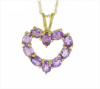 STERLING SILVER AMETHYST HEART PENDANT: Sterling silver with 14k gold plating, this open heart-shaped pendant is completely outlined with shimmering oval-shaped purple amethyst gemstones.-Brand new with box.