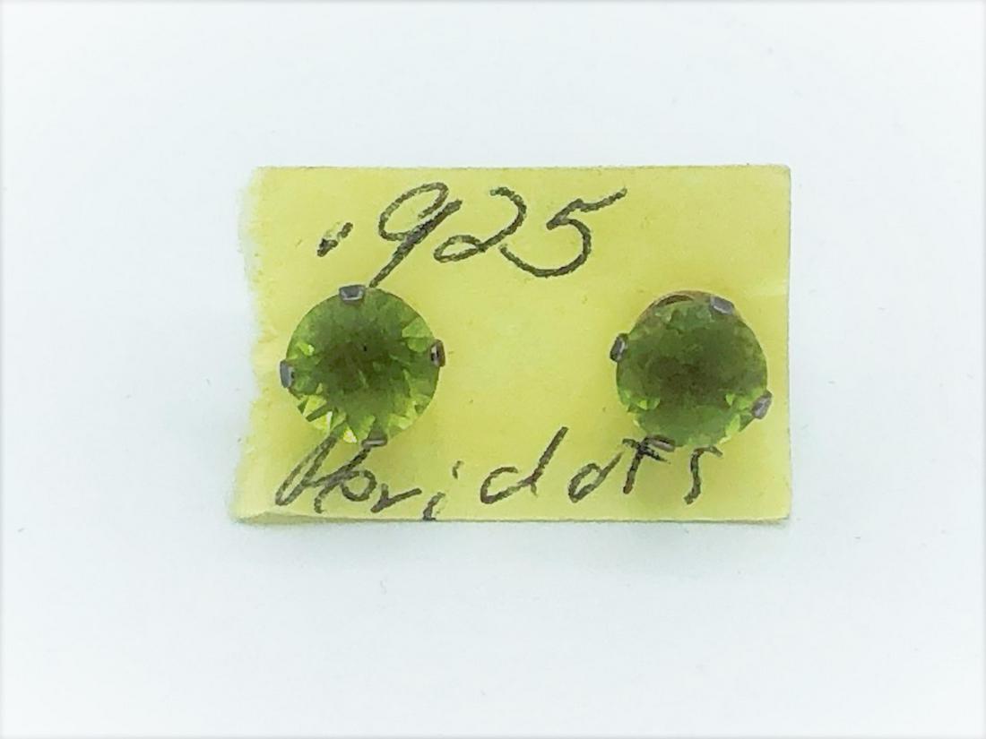 STERLING SILVER BUD EARINGS W/ MOUNTED STONE: STERLING SILVER BUD EARINGS W/ MOUNTED LIGHT GREEN STONE- SIZE: 0.5'' x 0.25" / PER UNIT- WEIGHT: 0.02 GR (TOTAL 2 UNITS)- CONDITION: GOOD- SS110221