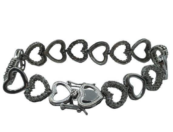 STERLING SILVER CHAINED HEARTS BRACELET: STERLING SILVER BRACELET WITH SOLID AND FAUX DIAMONDS CHAINED HEARTS - SIZE: 7.0''- WEIGHT: 16.5 GR - CONDITION: GOOD (ONE STONE MISSING ONLY ON ONE HEART)- SS110421
