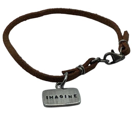 LEATHER STRING BRACELET WITH STERLING SILVER CHARM: LEATHER STRING BRACELET WITH STERLING SILVER CHARM- SIZE BRACELET: 7.0''- SIZE CHARM: 0.6' X 0.4"- WEIGHT: 5.7 GR - CONDITION: VERY GOOD- SS110421