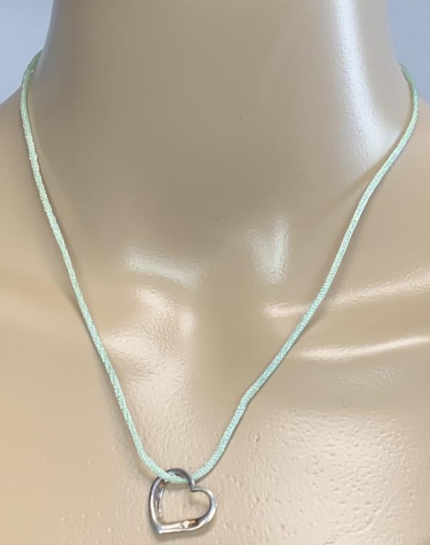STERLING SILVER HEART SUSPENDED ON A NECKLACE: STERLING SILVER HEART SUSPENDED ON A NECKLACE2 g