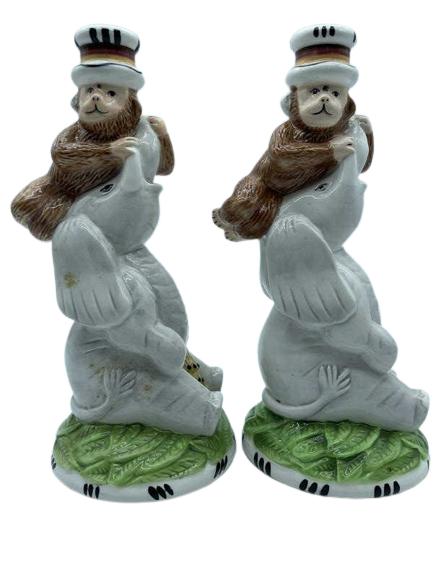 PAIR OF ELEPHANT & MONKEY CANDLESTICKS 9.5": PAIR OF SPARTAN GROUP JUNGLE SPREE MONKEY / ELEPHANT CERAMIC CANDLESTICKS| COLLECTIBLE PALM BEACH REGENCY SINGERIE SAFARI HOME DECOR-9.5" X 4" DIAMETER APPROX-VERY GOOD CONDITION