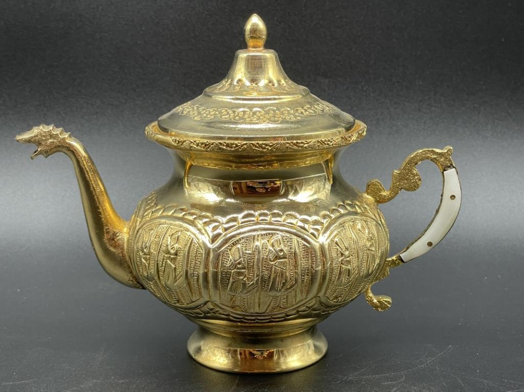 PERSIAN TEA POT W MOTHER OF PEARL HANDLE 6": VINTAGE MIDDLE EAST PERSIAN GOLD SILVERPLATE SERVEWARE TEA POT WITH MOTHER OF PEARL STYLE HANDLE-6" APPROX-VERY GOOD OVERALL CONDITION WEAR CONSISTENT WITH AGE, SEE ALL PHOTOS-DP42022