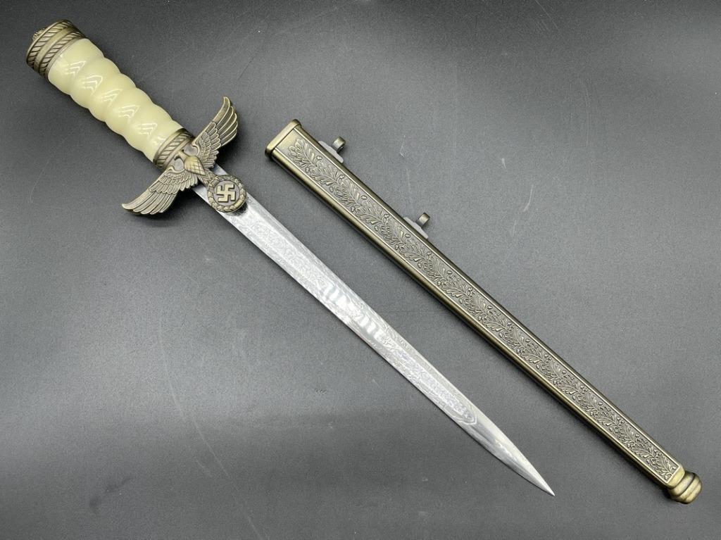 REPLICA NAZI GERMANY WWII NAVY OFFICER DAGGER 16": REPLICA NAZI GERMAN WWII NAVY OFFICER DRESS DAGGER & SHEATH -16" X 3" APPROX-VERY GOOD CONDITION-DP12522 THIRD PARTY SHIPPING REQUIRED ON ALL ITEMS. A list of shippers can be found in our Shipping Pol