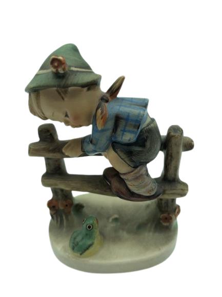 GOEBEL HUMMEL " RETREAT TO SAFETY" FIGURINE 4": GOEBEL HUMMEL " RETREAT TO SAFETY" FIGURINE LITTLE BOY CLIMBING FENCE-W GERMANY-4"VERY GOOD OVERALL CONDITION WEAR CONSISTENT WITH AGE, SEE ALL PHOTOS-DP42022
