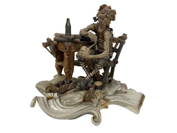 CAPODIAMONTE PINOCCHIO COLLECTIBLE FIGURINE 13": "NASCITA DE PINOCCHIO " TIZIANO GALLI CAPODIAMONTE-GOOD VINTAGE CONDITION. BOTTLE IS BROKEN ON WORK BENCH. SEE ALL PICTURES-10" X 13" APPROX THIRD PARTY SHIPPING OR LOCAL PICKUP REQUIRED ON ALL ITEMS.