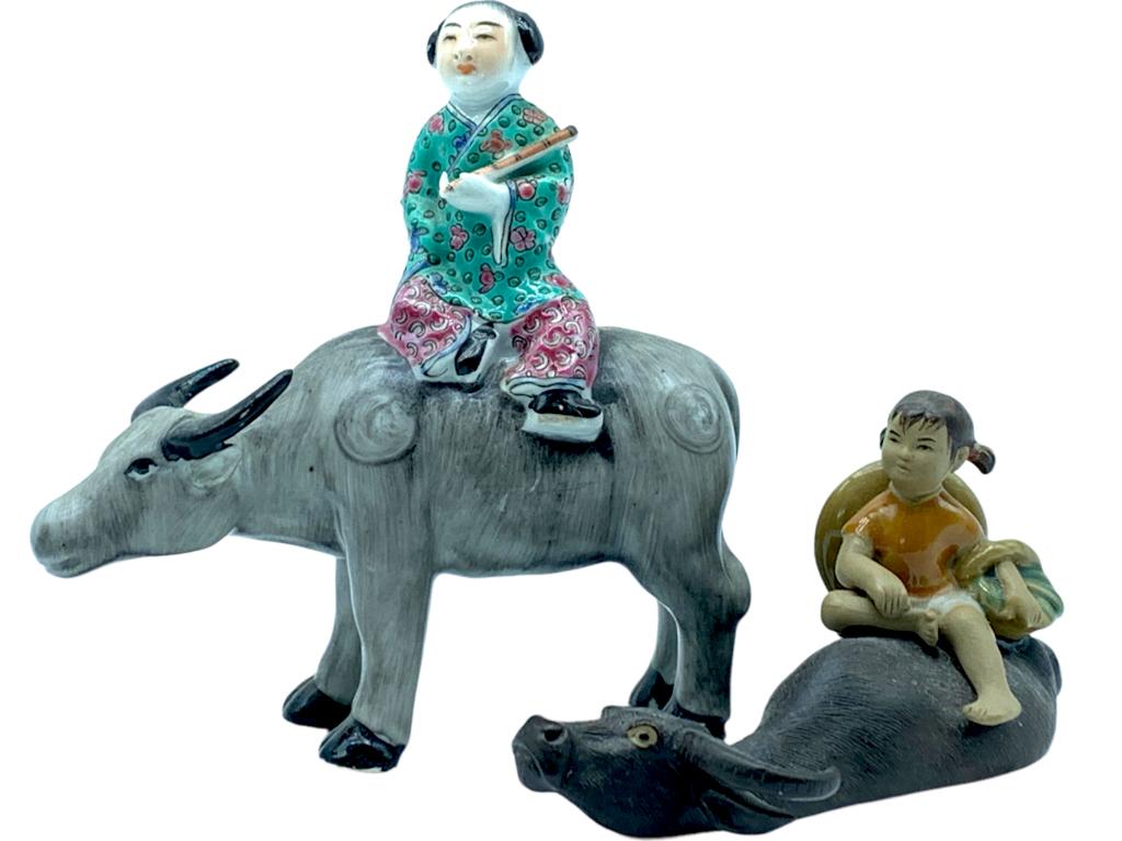 VTG COLLECTION OF CHINESE FIGURES ON WATER BUFFALO: -VTG COLLECTION OF CHINESE FIGURES ON WATER BUFFALO-(1)VTG CHINESE HERDBOY RIDING WATER BUFFALO FIGURINE -(1)VTG CHINESE SHIWAN POTTERY ART GIRL ON WATER BUFFALO FIGURINE-SET OF 2 FIGURINESJR 11/04