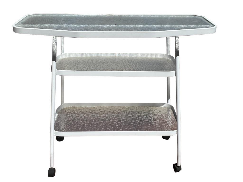 VINTAGE MID MOD OUTDOOR BAR CART: VINTAGE MID MOD OUTDOOR BAR CART | MID CENTURY MODERN BAR CARTS-ALUMINIUM WITH WATER GLASS SHELVES-PRE OWNED CONDITION, WEAR FROM OUTDOOR USE-SIZE: 41" X 48" X 21"-DP93022