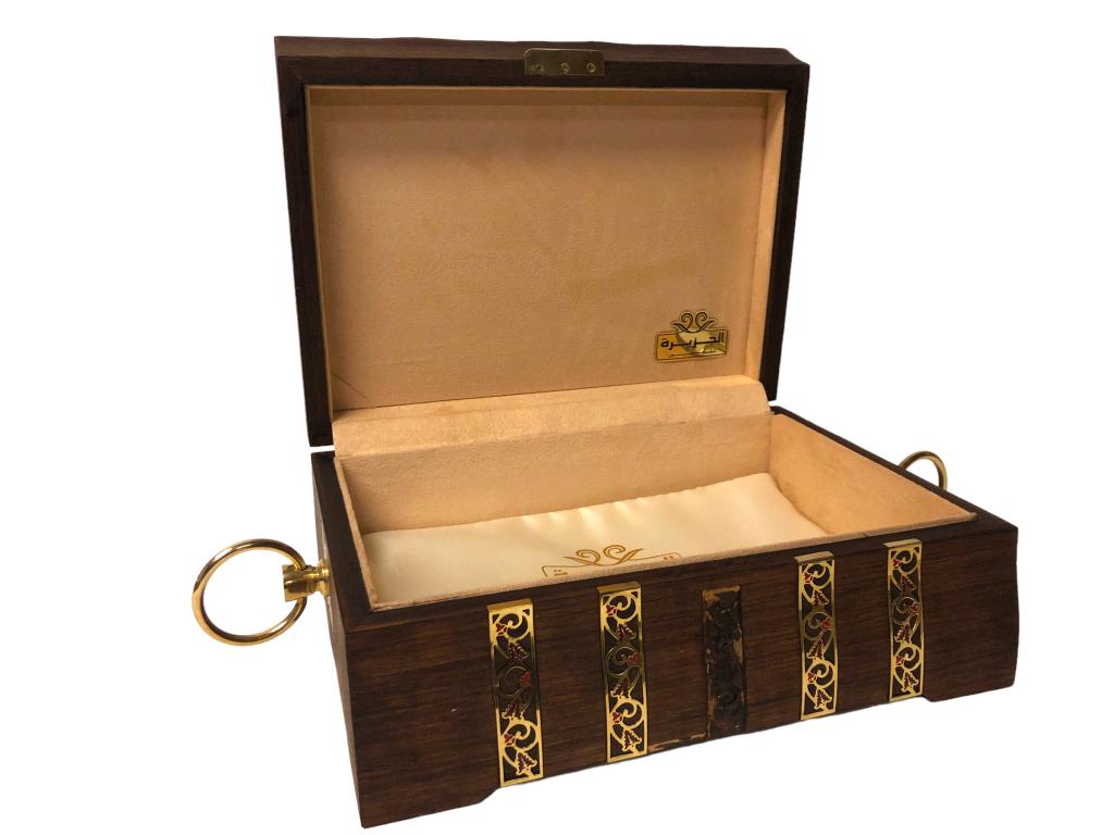 AL JAZEERA PERFUMES DECORATED WOODEN CHEST 13": -AL JAZEERA PERFUMES DECORATED WOODEN CHEST 13" -DECORATIVE CHEST WITH ORNATE GOLD AND RED INLAY -PLUSH LINED INTERRIOR-METAL HANDLES-SIZE: 13" X 10" X 5"